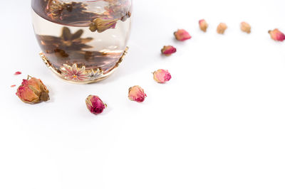 High angle view of glass on table against white background