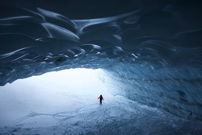 Person in snowcapped mountains during winter