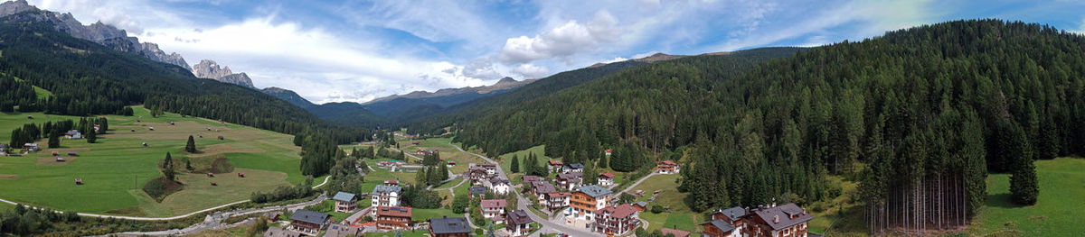 Panoramic view of crowd on mountain against sky