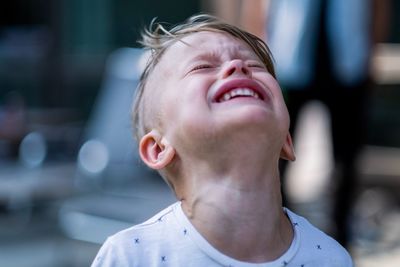 Close-up of boy crying outdoors