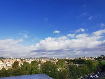 Scenic view of sea by buildings against sky