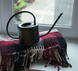 Close-up of coffee cup on table at home