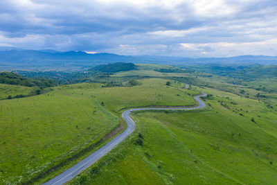 Above view of countryside road, aerial drone view