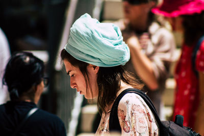 Side view of women looking at camera