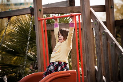 Low angle view of girl standing on playground