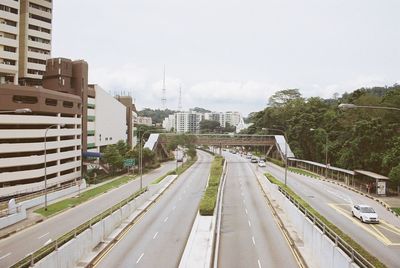 Road in city against sky