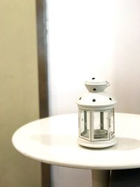 Close-up of electric lamp on table