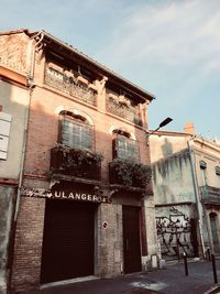 Low angle view of old building against sky