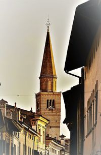 Low angle view of bell tower against sky