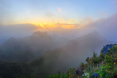 Scenic view of mountains against sky during sunset