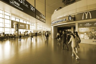 Group of people walking in airport