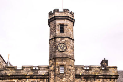 Low angle view of clock tower against sky