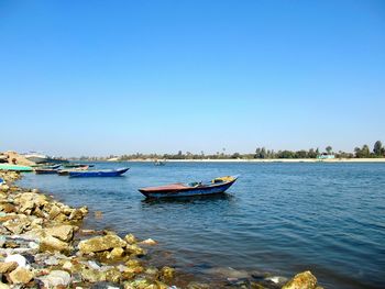 Scenic view of sea against clear blue sky