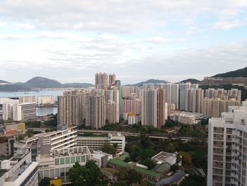 High angle view of buildings in city against sky