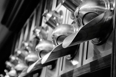 Low angle view of lighting equipment hanging on ceiling