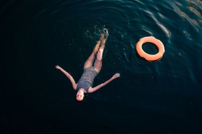 High angle view of woman swimming in sea