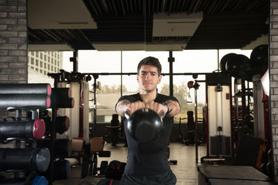 Portrait of man standing in corridor