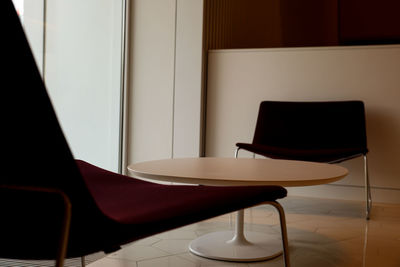 Close-up of empty chair on table at home