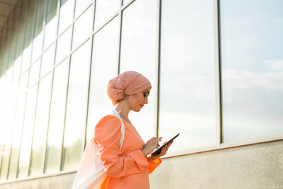 Young woman using mobile phone