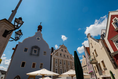 Low angle view of buildings in city against sky