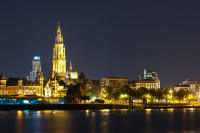 Illuminated buildings in city at night