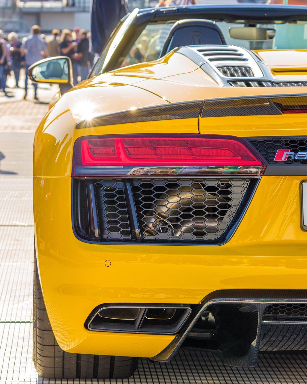 CLOSE-UP OF YELLOW CAR ON BUS