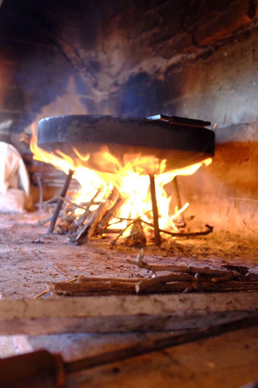 CLOSE-UP OF FIRE BURNING IN THE DARK