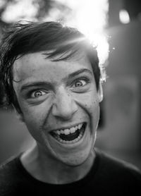 Close-up portrait of laughing young man