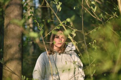 Portrait of woman seen through plants