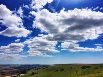 Scenic view of landscape against cloudy sky