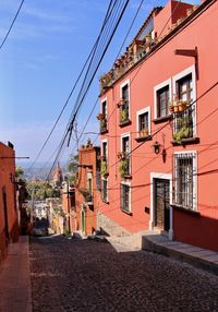 Balconies and cobbled street with the cathedral in the background