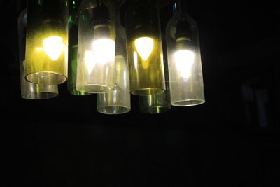 Close-up of lit lamp at night