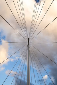 Low angle view of suspension bridge against sky