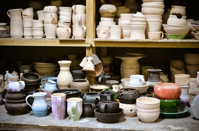 Various ceramics displayed for sale at market stall
