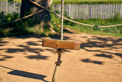 Close-up of swing at playground