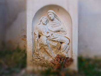 Close-up of old carving on wall