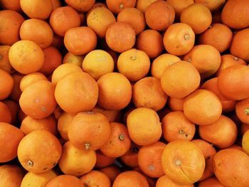 Full frame shot of oranges at market stall