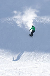 Full length of person skiing on snowy mountain