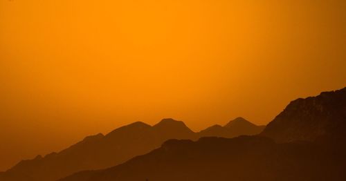 Scenic view of mountains at sunset