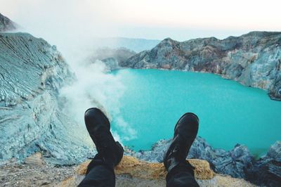 Low section of man on rocks