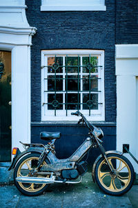 Bicycle parked outside building