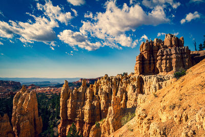 Panoramic view of rock formations against sky