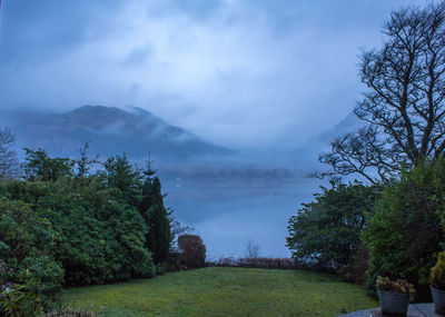 Scenic view of landscape against cloudy sky