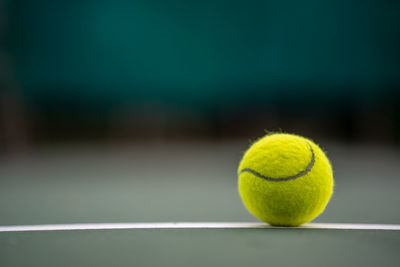 Close-up of tennis ball on field