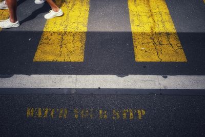 High angle view of people walking on crosswalk