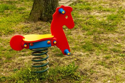 Toy car on field in park