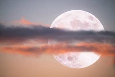 Scenic view of moon against sky at sunset