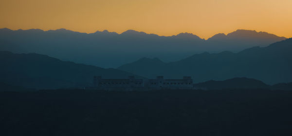 Scenic view of mountains against sky during sunset