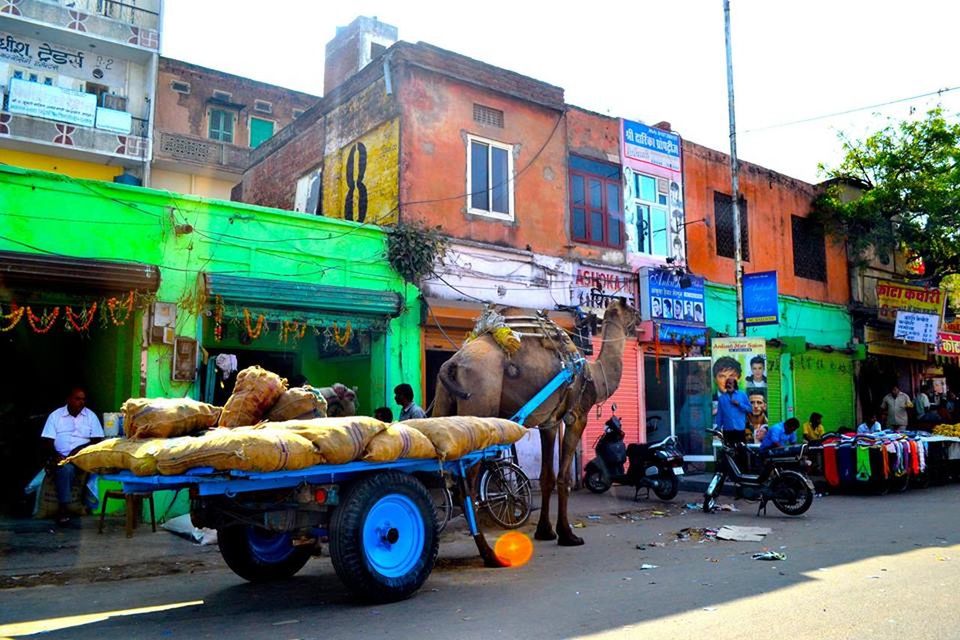 PEOPLE ON STREET AGAINST BUILDINGS