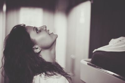 Close-up of young woman at home